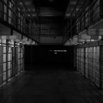 black and white photo of an empty prison
